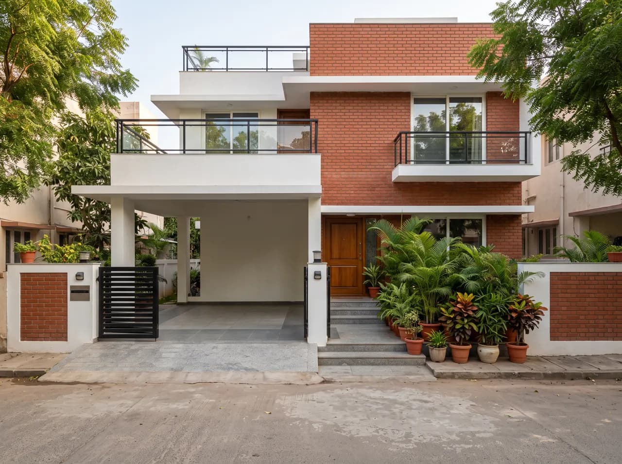 Double floor house elevation with red brick upper floor and car portico