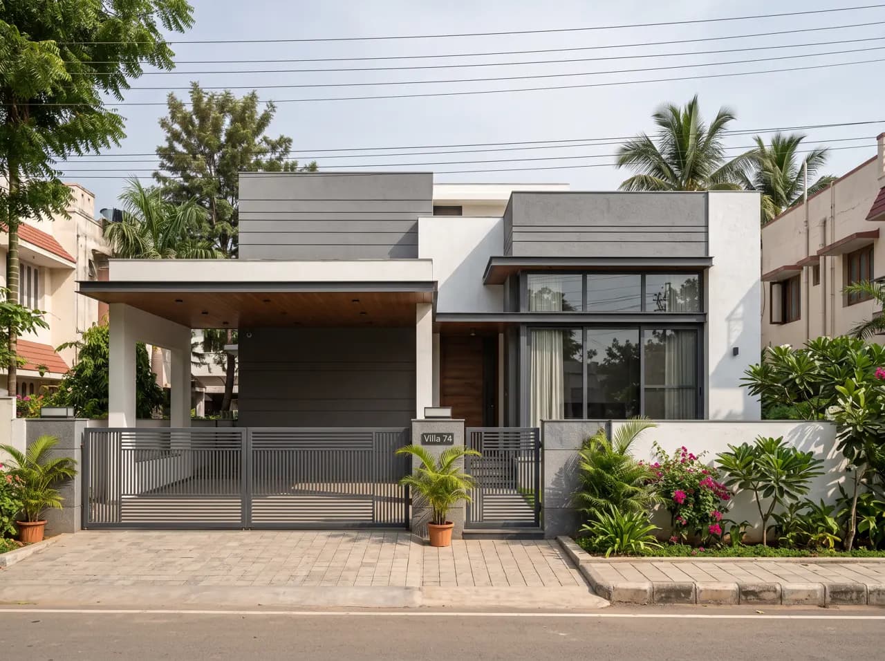 Single floor house elevation with grey panels, covered porch and metal gate
